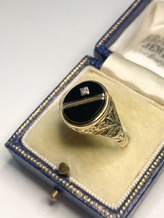 A beautiful vintage 9 karat gold ring. Featuring a beautiful round black onyx with a natural small diamond in the centre with stunning floral scroll work to the left and right. Hallmarked 375 for 9 karat gold and made in the exact year of 1987. The perfect ring to wear for any occasion! Size UK/AUS V Size US 10 3/4 Condition: In above excellent vintage condition. Please look at the photos as they are truly representative of the condition of this amazing ring! All our items are including postage Scroll Work, Ring Black, Antique Jewellery, Perfect Ring, Black Rings, Rings Statement, Black Onyx, Gold Ring, Favorite Jewelry