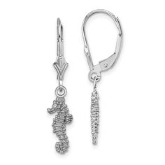 a pair of seahorse earrings with diamonds on the bottom and side of each ear