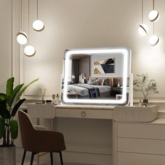 a mirror that is on top of a desk next to a chair and potted plant