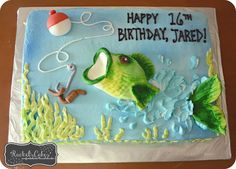 a birthday cake that is shaped like a fish