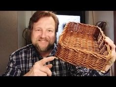 a man holding a basket in his hand