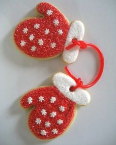 two decorated cookies sitting on top of each other