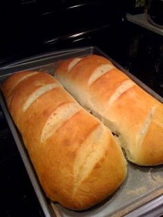 two loaves of bread sitting in an oven