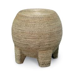 an elephant shaped stool made out of straw