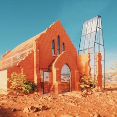 a red brick church sitting on top of a dirt field