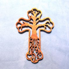 an ornate wooden cross on a white background