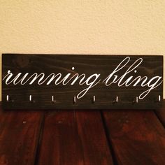 a wooden sign that says running king on it