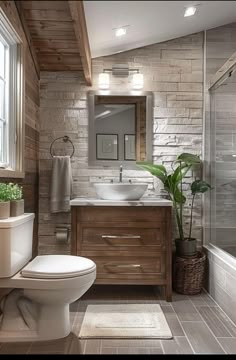 a bathroom with a toilet, sink and bathtub next to a large window in the corner