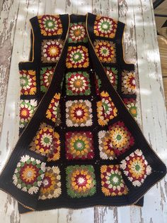 🌻This unique crocheted vest stands out with its elegant and intricate multi-patterned design on a black base. Carefully crafted with soft, warm, and high-quality cotton yarn, it is perfect for all-season use. 🧶This special piece will not only elevate your style but also provide exceptional comfort.🌱 Every detail is meticulously handcrafted. 🎁💝If you're looking for a sustainable and bohemian-inspired unique gift for your loved ones, this vest is the perfect choice for you.🌻 ✔ Hand wash (max Granny Square Sweater Vest Pattern, Granny Square Sweater Vest, Crochet Granny Square Vest, Granny Square Crochet Cardigan, Granny Square Vest, Crocheted Vest, Crochet Unique, Hippie Clothing, Crochet Boho