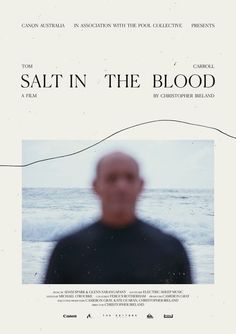 a man standing in front of an ocean with the words salt in the blood on it