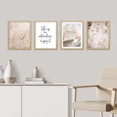 three framed art prints on the wall above a white cabinet with a chair and vase