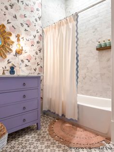 the bathroom is decorated in pastel colors