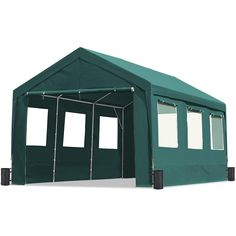 a large green tent with windows on the front and side walls, set up against a white background