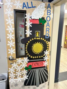 a door decorated with an image of a train and snowflakes on the side