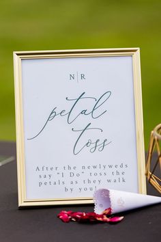 a sign that reads, n r petal toes after the newlyweds say i do't toss the petals as they walk