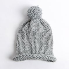 a gray knitted hat on a white background