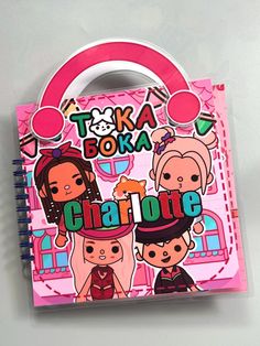 a pink notebook with cartoon characters on the front and back cover that says toki boka charlotte