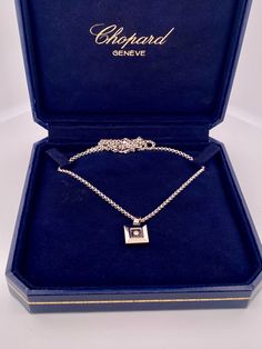 Welcome to GKJ!! Beautiful and classic CHOPARD 18k white gold necklace with happy floating diamond square pendant.  Comes with original inner and outer box and certificate.  Great piece and gift idea for any special occasion.  Details below Material  18k gold, diamond Weight    13.4 gm Size          18' Hallmark    CHOPARD 750  SHIPS SAME DAY PLEASE, BE SURE TO VIEW THE PICTURES CAREFULLY AND CLOSELY AS IT IS THE EXACT ITEM YOU ARE BUYING.  Gold Knox Jewelry  opened its storefront in Pasadena, CA in 2011, since then we do our BEST to serve our communities. A few years later we opened our online shop and joined Etsy  where we offer our unique and desirable pieces for everyone. Most of our items are vintage and they are previously used, however we inspect and clean each of them before sellin Gold Plated Box Chain Pendant Jewelry, Luxury Symbolic Necklace With Box Chain, Luxury Symbolic Jewelry With Box Chain, Gold Plated Square Pendant With Box Chain, Luxury Gold-plated Box Chain Jewelry, Chopard Jewelry, Gold Jewelry Necklace, Square Pendant, White Gold Necklaces