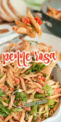 a plate full of pasta with broccoli and tomatoes on it, being held up by a fork