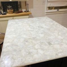 a counter top in a kitchen next to a window