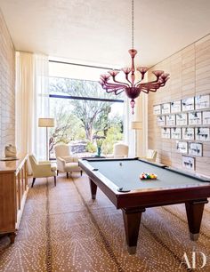 a pool table in the middle of a living room