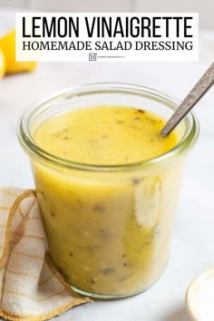 lemon vinaigrete homemade salad dressing in a small glass jar with a spoon