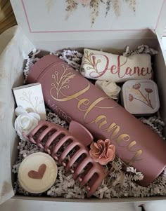 an open gift box filled with decorative items