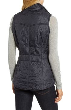 Diamond quilting adds subtle texture to a sleek nylon vest featuring cozy fleece lining and tonal logo embroidery at the pockets. 26 1/2" front length; 29" back length Front zip closure with snap placket Stand collar Dual-entry hand-warmer pockets Fleece lining, with synthetic fill 100% polyamide Machine wash, dry flat Imported Women's Clothing Fitted Quilted Nylon Vest, Quilted Nylon Vest For Fall, Quilted Nylon Vest For Cold Weather, Quilted Vest, Diamond Quilt, Logo Embroidery, Merlot, Quilted Jacket, Embroidery Logo