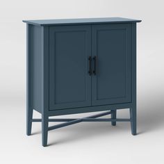 a small blue cabinet with two doors