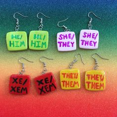 Each charm measures ~1 x ~1" & 0.25" thick & can be customized! You also have the choice of either regular earring wire hooks, or clip ons! NOTE:  Both earrings can have the same sets of pronouns, or you could have one earring with one set & another earring with another set! You can explain what you want in the personalization box! You will receive one set containing two earrings. This is a handmade item, so exact color & appearance may vary. Acexual Earrings, Gay Dangle Earrings, Bigender Earrings, Bisexual Earrings, Trans Flag Earrings, Earring Wire, Jewelry Earrings Dangle, Dangle Drop Earrings, Dangle Earrings