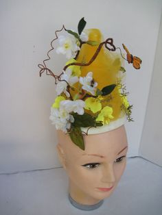 "* A unique style and height this Bumble Bee Hive headpiece has been made with layers of honey colored tulle netting accented with petite white flowers, summer greens and adorable mini feathered bees and a single monarch butterfly. Made specifically for the gal who love lots of 'honey' and would to be the center of attention. * The black and yellow mini bumble bees have feather wings. The curly brown branches can be adjusted and moved around as well. * This design stands about 7\" tall measured Sadies Dance, Buzz Bee, Bee Costume, Easter Hats, Flowers Butterfly, Bumble Bees, Easter Parade, Engagement Celebration, Feather Wings