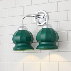 two green lights are on the wall next to each other