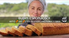 a woman with grey hair is smiling and holding a loaf of bread in front of her