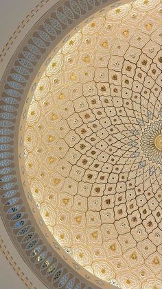 an intricate ceiling in the middle of a building