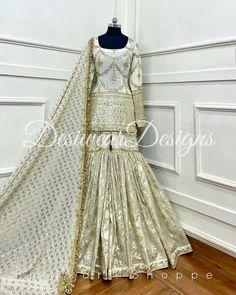 Made to Order/Measurement/Custom Order Sharara suit - Color : Ivory - Fabric : Embroidered Georgette and banarasi -  Dupatta with Gold Border - - It can be customize in any design or size and color PLEASE NOTE: BUYERS ARE RESPONSIBLE FOR ANY CUSTOMS AND IMPORT TAXES THAT MAY APPLY. This is a made to order product. If you opt for 'Made To Measurement Option', we will provide a measurement template and you can share the measurements likewise. If you want to opt for 'Standard Size', Please refer to the size chart provided in the listing. Shipping: Standard Shipping is done by DHL ecommerce and it mostly takes 2 to 3 weeks to deliver after dispatch. Express Shipping is done by DHL express and it mostly delivers within a week after dispatch. Fabric Care : Dry Clean Only PLEASE NOT THE FRINGES I Beige Semi-stitched Sharara For Eid, Designer Beige Georgette Sharara, Off White Sharara With Dabka Work For Wedding, Wedding Off-white Sharara With Dabka Work, Bollywood Style White Georgette Sharara, White Chinon Sharara For Wedding, Bollywood Style Beige Sharara With Intricate Embroidery, Beige Bollywood Sharara With Intricate Embroidery, Festive White Chinon Dress