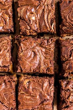 brownies with chocolate frosting are arranged in rows