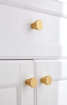 white cabinets with gold handles and knobs