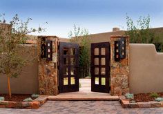 an entrance to a home with stone walls and doors