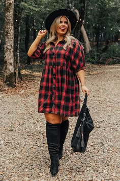 - This beautiful plaid dress has arrived just in time for cider season! - Unlined material with a plaid print - A collared neckline - A button-up front - Short sleeves with elastic cuffs - A relaxed silhouette that ends in a mid-thigh length hemline Flannel Christmas Party Theme Outfit, Western Christmas Outfits Women, Plaid Dress Outfit Winter, Cute At Home Outfits, Red Fall Dress, Plaid Dress Outfit, Holiday Shoot, Plaid Dresses, Christmas Dress Women