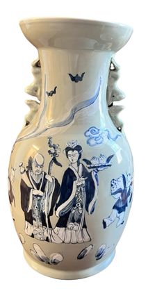 a blue and white vase with people painted on it