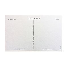 a white postcard with black writing on the front and back side, which reads'post card '