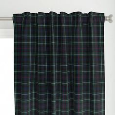 a black watch tartan curtain hanging on a window