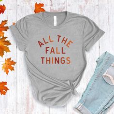 All The Fall Things in a modern font graphic on front in cream or multi Fall colors. Youth Sizes S-XL (unisex sizing) Toddler Sizes 2T, 3T, 4T To view All The Fall Things Adult T-shirts click here.To view All The Fall Things Baby Bodysuit click here.Bella + Canvas4.2 oz. Airlume combed and ring-spun cottonPre-shrunkFor a more relaxed fit, size up! Everyday Fall T-shirt With Letter Print, Everyday Fall Slogan T-shirt, Fall Everyday T-shirt With Screen Print, Fall Graphic Tee Soft-washed, Casual Fall T-shirt With Text Print, Trendy Screen Print T-shirt For Fall, Fall Short Sleeve T-shirt With Text Print, Trendy Fall Letter Print T-shirt, Trendy Letter Print T-shirt For Fall