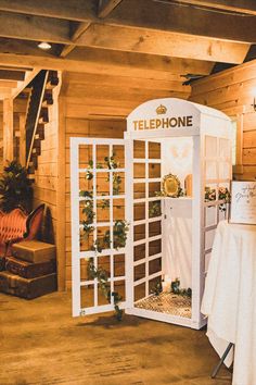 a phone booth is set up in the middle of a room