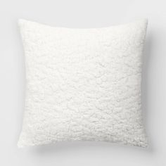 a white pillow on a gray background