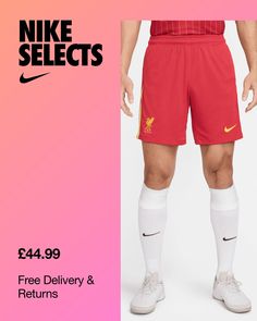 a man in red shorts and white socks with the words nike selectrs on it