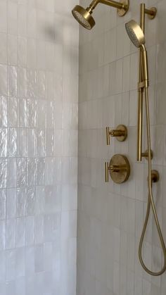 the shower head and handset are gold in color