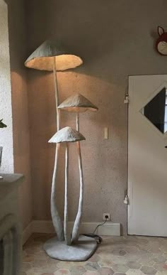 a lamp that is sitting on top of a table next to a mirror and door