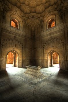 the interior of an old building with arches and windows