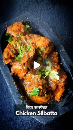 chicken silabataa with cilantro and parsley in a black tray